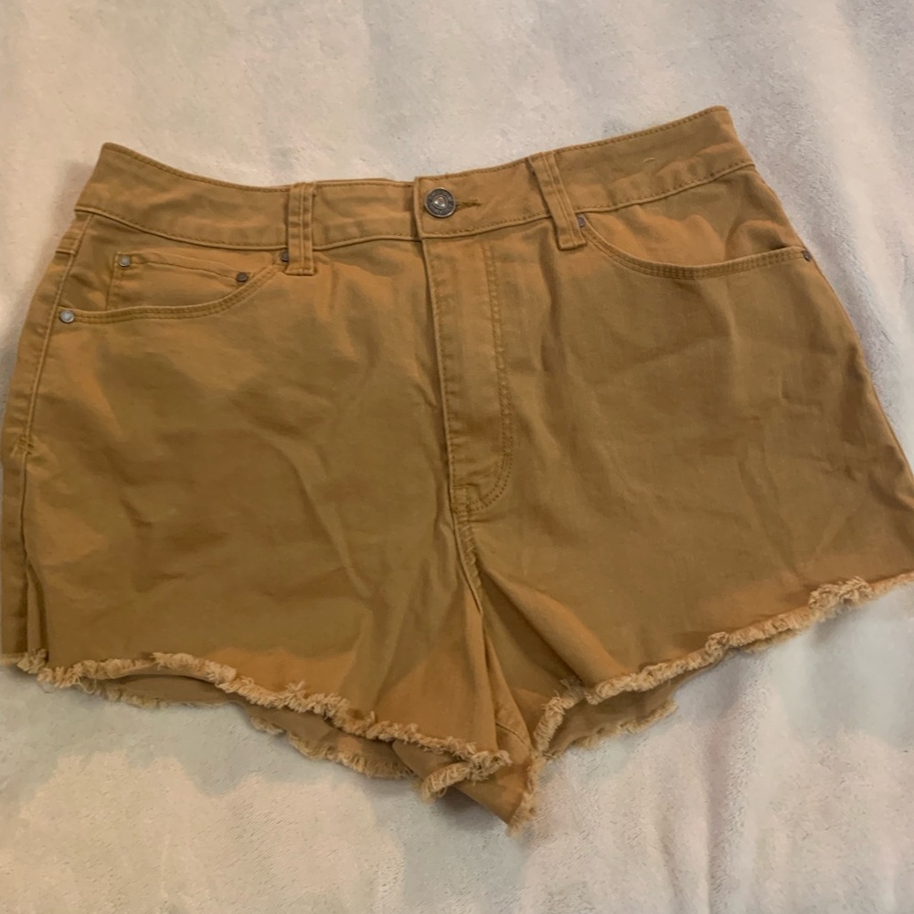 Tan shorts.